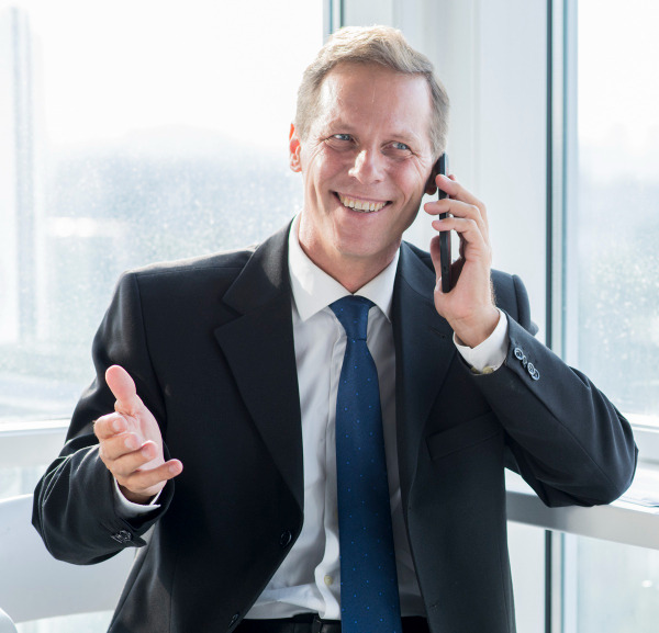 An attorney on the phone during a conversation with a wrongful death client