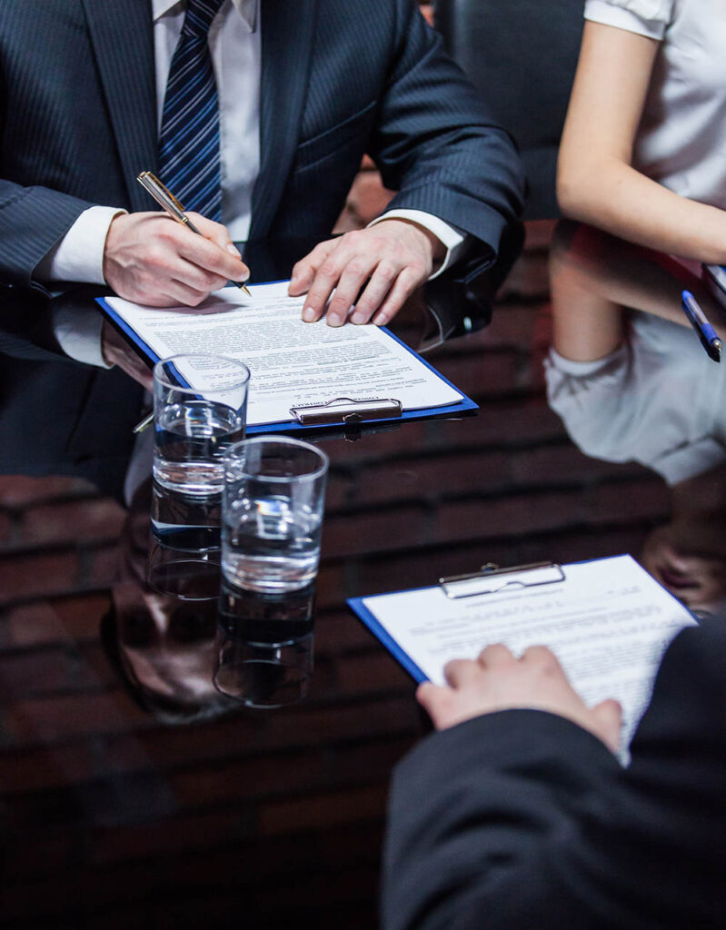 An attorney during case evaluation meeting with a client at the office